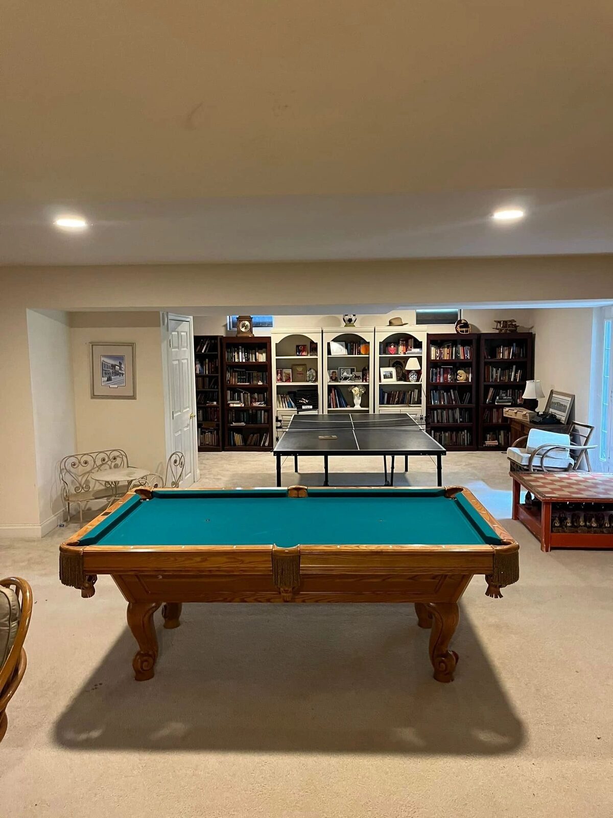 Recessed lighting in a finished basement game room
